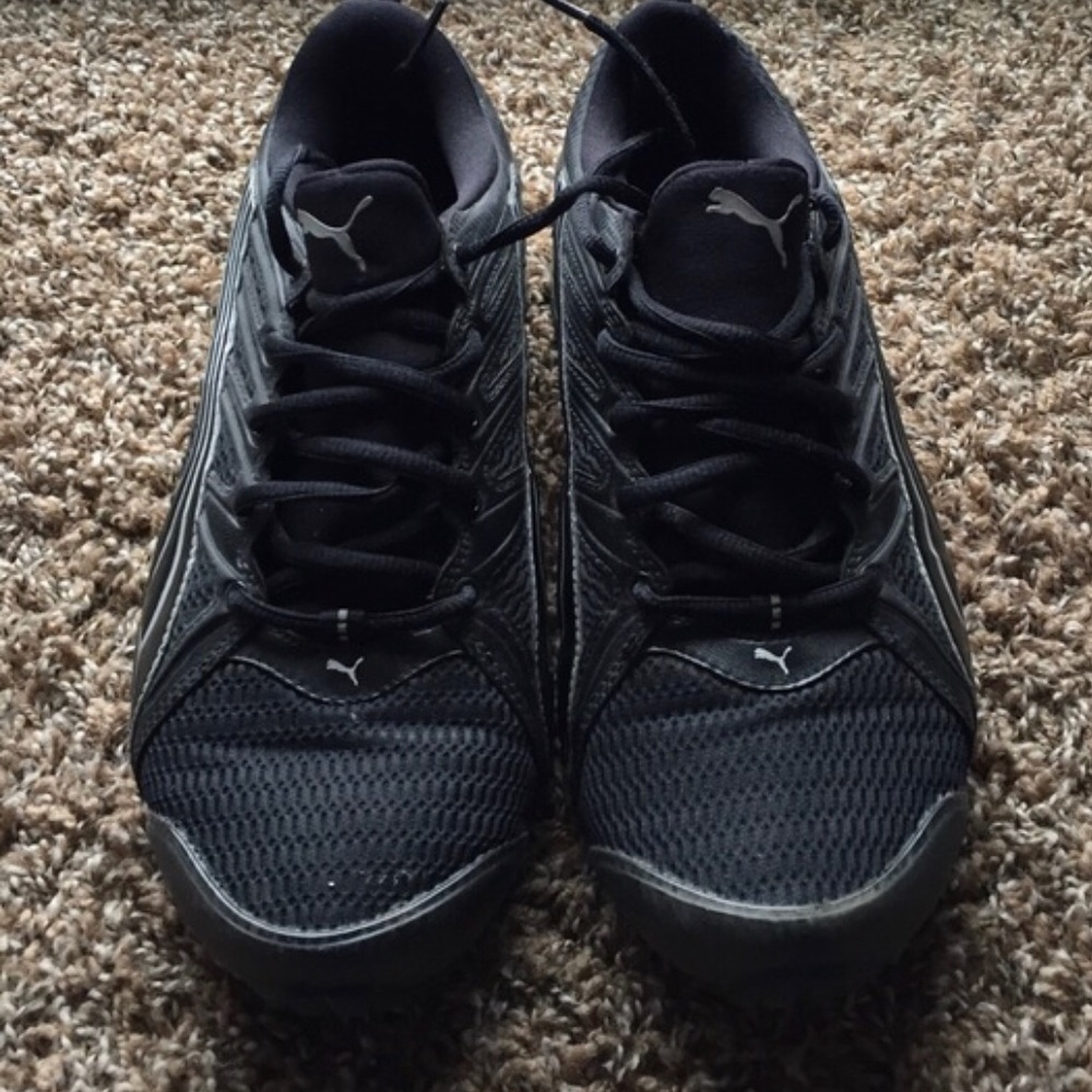 Puma black and silver tennis shoes.